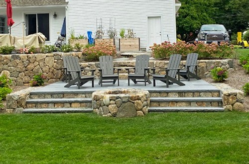 Fire pit with steps to patio by New View